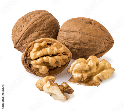 nuts and walnut kernels on a white background