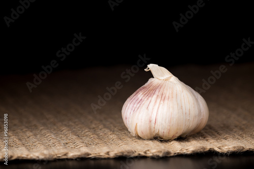 Garlic bulb on the dark background