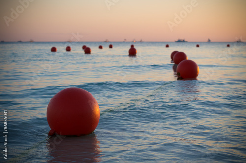 buoys at sunset photo