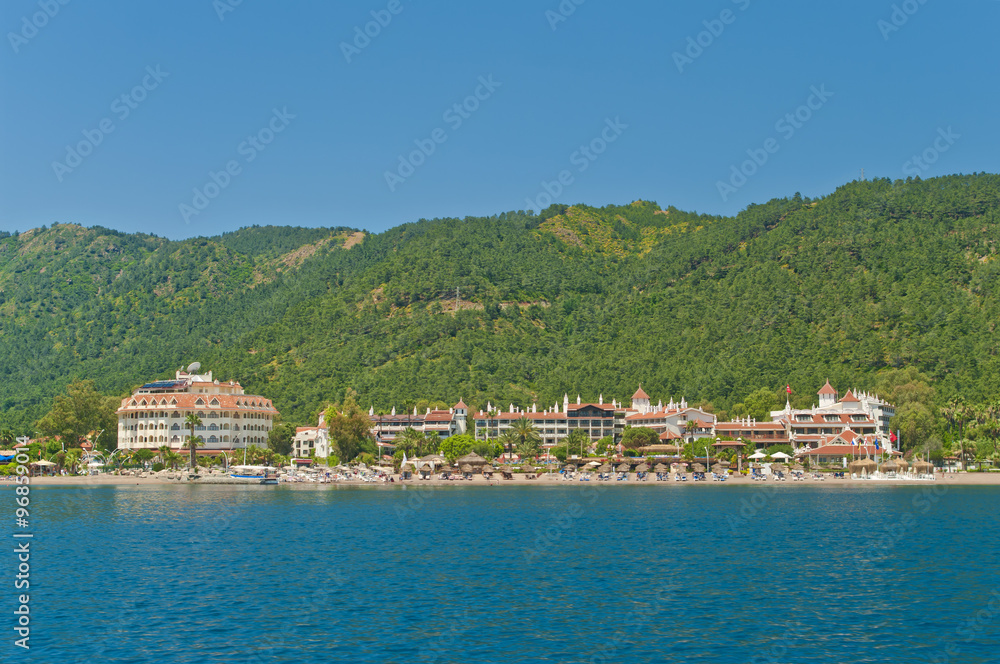 view of holiday resorts and beach from sea