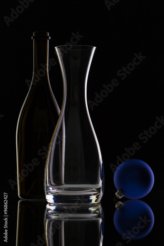 The bottle of wine,glass carafe and Christmas decoration