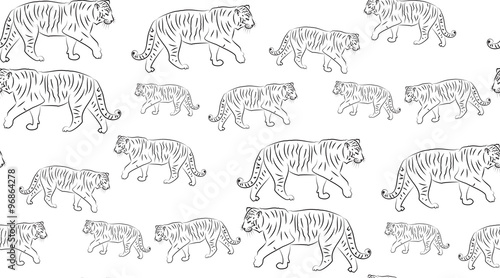 Vector abstract seamless background of tigers. The tigers are randomly located.