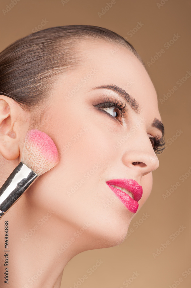Cheerful female model is receiving skin treatment Cheerful female model is receiving skin treatment