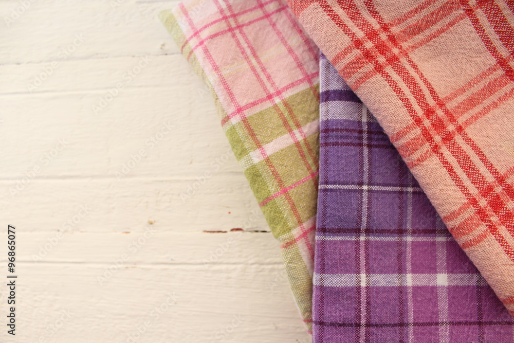 Three different plaid table clothes on table - cleaning kitchen concept Three different plaid table clothes on table - cleaning kitchen concept