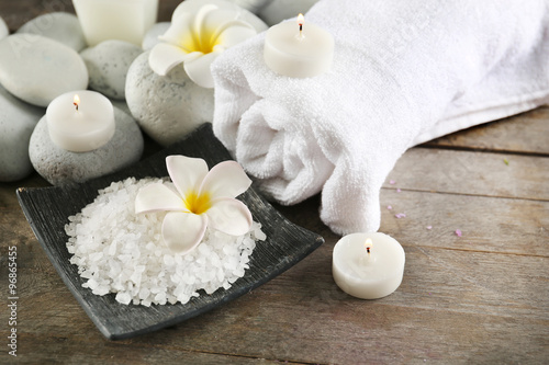 Spa still life with white flower on wooden table, closeup