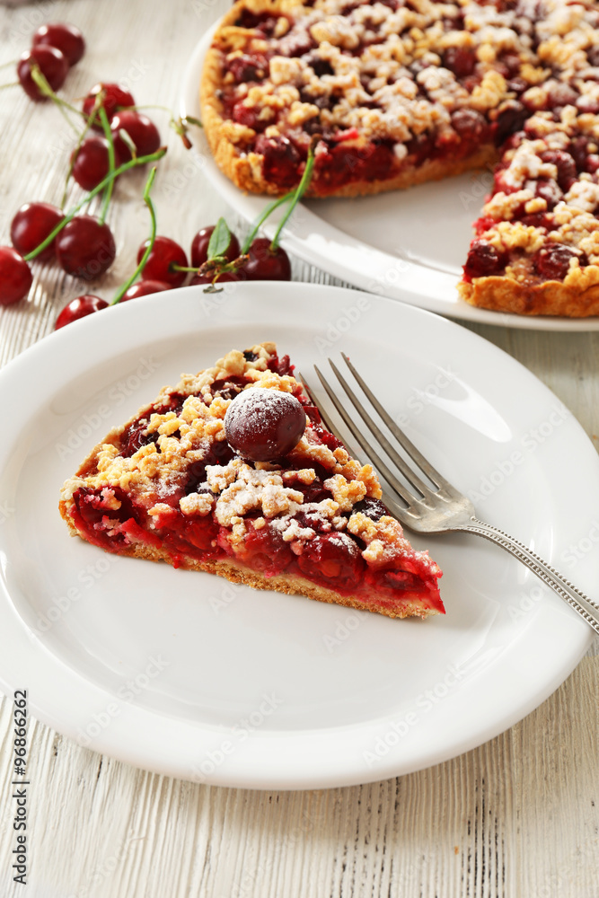 Tasty homemade pie with cherries on table close up Tasty homemade pie with cherries on table close up
