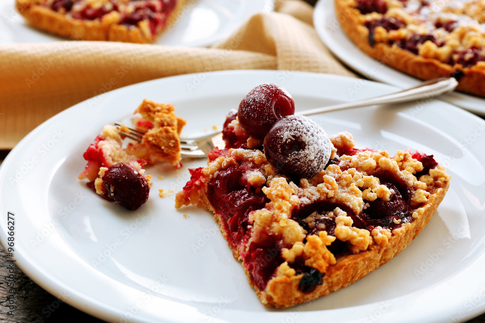 Tasty homemade pie with cherries on table close up Tasty homemade pie with cherries on table close up