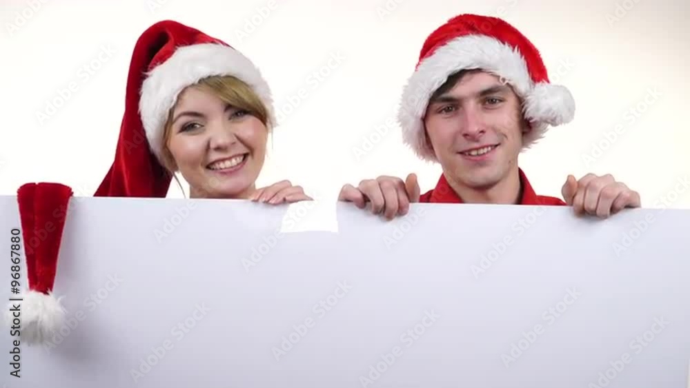 Couple with blank empty banner board. Christmas 4K Couple with blank empty banner board. Christmas 4K
