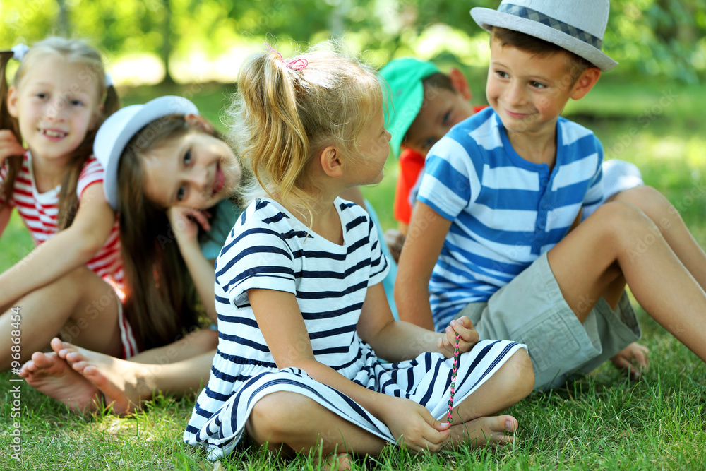 Fototapeta premium Happy active children on green grass in park