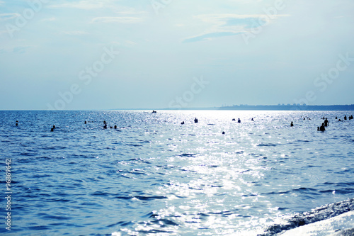 Swimming people in the sea