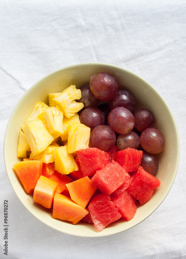 Top view of Fruits and Berries: water-melon, pineapple, papaya, grapes Top view of Fruits and Berries: water-melon, pineapple, papaya, grapes