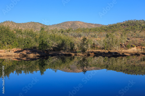 Morning light on a calm tropical river in North Queensland.
