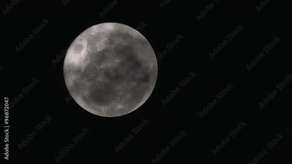 Mysterious clouds pass over full moon night. Mysterious clouds pass over full moon night.