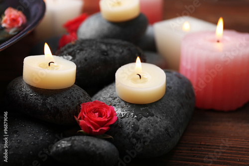 Spa composition of flowers  candles and stones  close-up