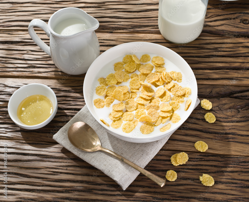 Cornflakes cereal and milk. Cornflakes cereal and milk.