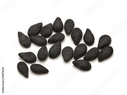 Macro closeup of Organic Black Sesame (Sesamum indicum) isolated on white background.