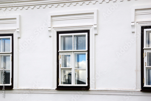 Window on the white wall of the house