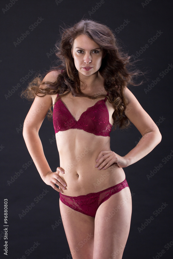 Fototapeta premium Attractive Sexy woman with beautiful body posing and wear red un
