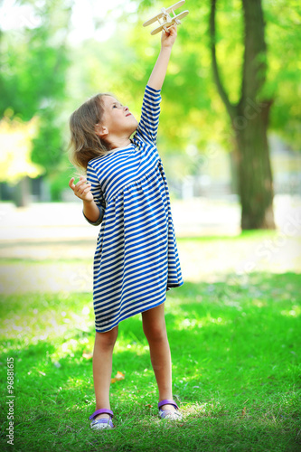 Beautiful little girl plays...