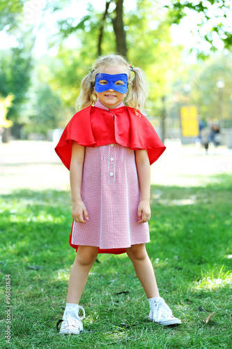 Superhero little girl plays...