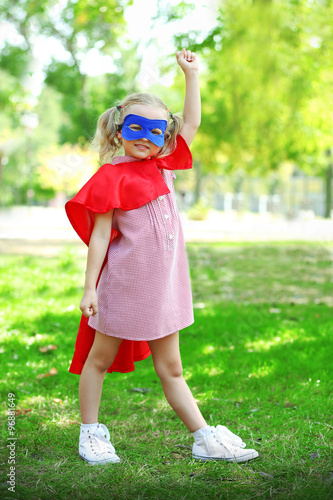 Superhero little girl plays...