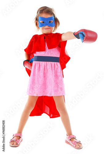 Superhero little girl poses...