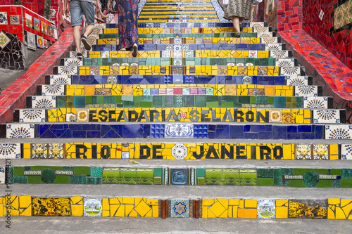 Tourists visit the colorful mosaic tiles at the Selaron Steps in Lapa, Rio de Janeiro, Brazil