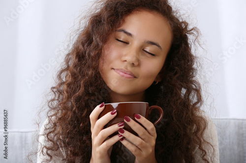 Relaxed young woman enjoyin...