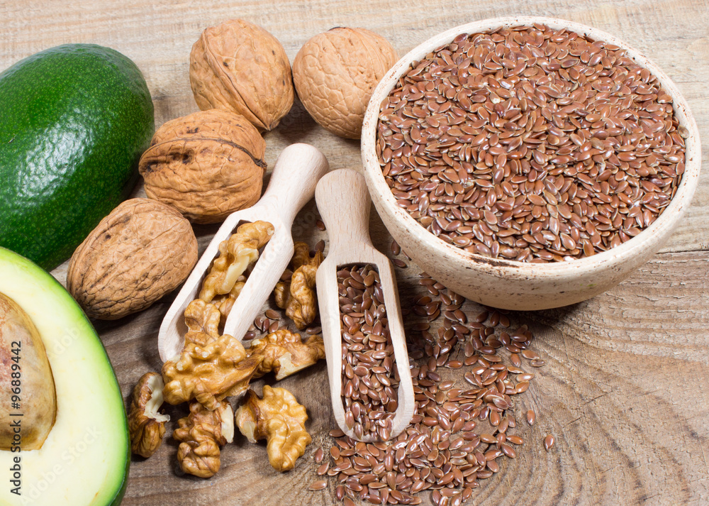 Sources of omega 3 fatty acids flaxseeds, avocado and walnuts Stock