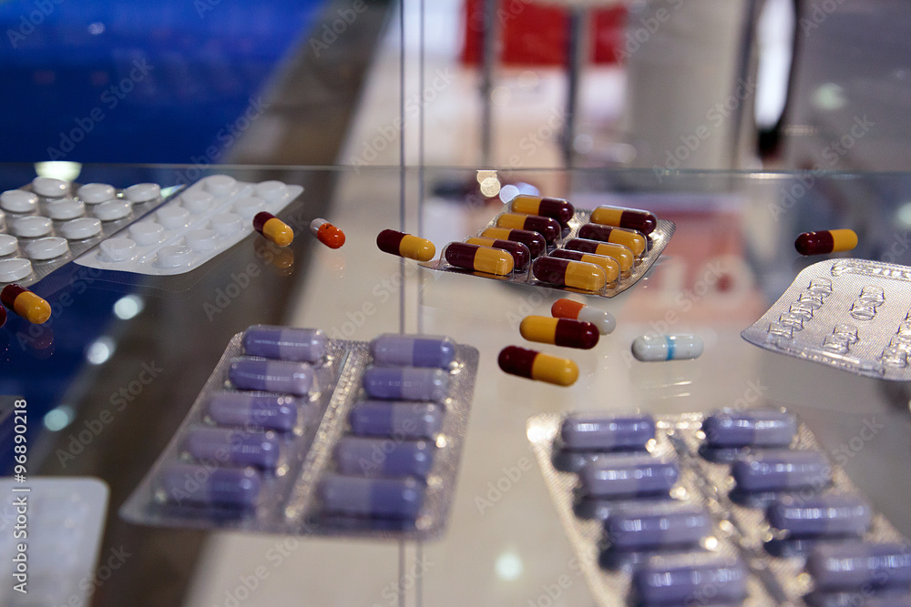 Tablets vitamins in a plastic container. Tablets vitamins in a plastic container.
