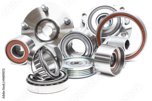 located on a white background variety of bearings and rollers wide range of applications, from automotive hub to engine belt tensioners