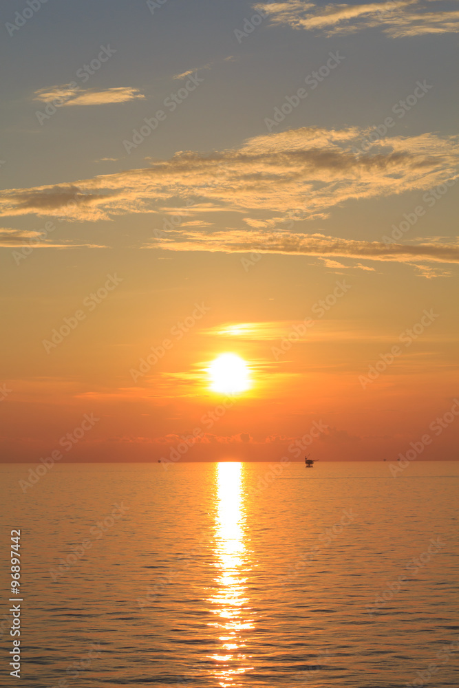 Offshore Production Platform in Sunset Time with Yellow Sky