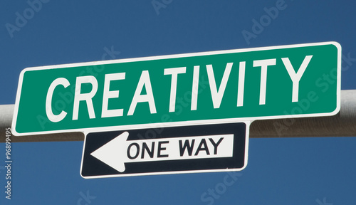 Creativity printed on green overhead highway sign with one way arrow  © Rex Wholster