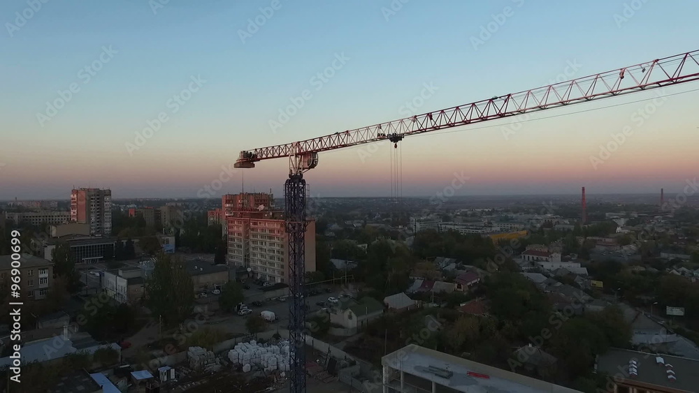 Tower crane at sunset. Departure quadrocopters. Aerial photography Tower crane at sunset. Departure quadrocopters. Aerial photography
