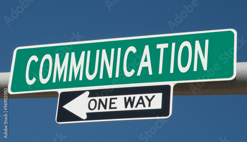 Communication on green overhead highway sign with one way arrow  © Rex Wholster