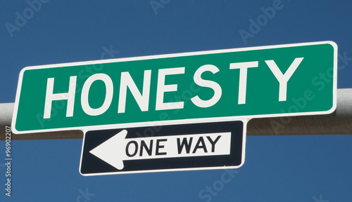 Honesty on green overhead highway sign with one way arrow  © Rex Wholster