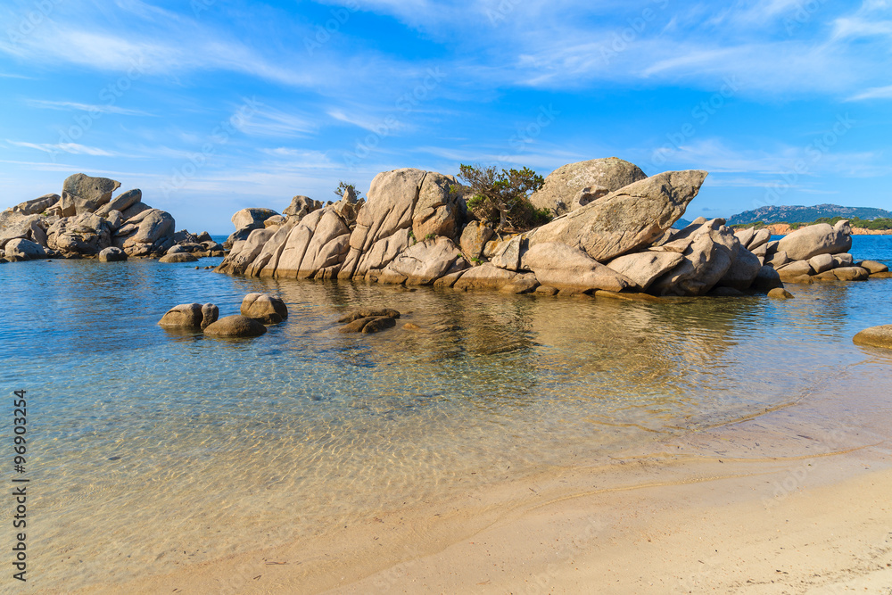 Rocks in sea water on Palombaggia beach, Corsica island, France