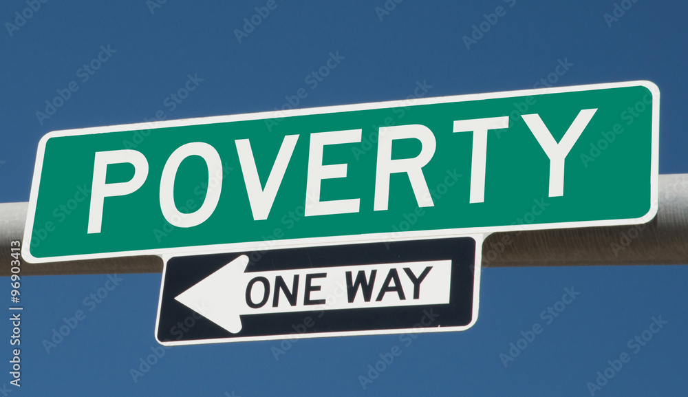 Poverty printed on green overhead highway sign with one way arrow 