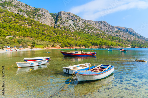 Traditional fishing boats in sea bay on secluded beach  Samos island  Greece
