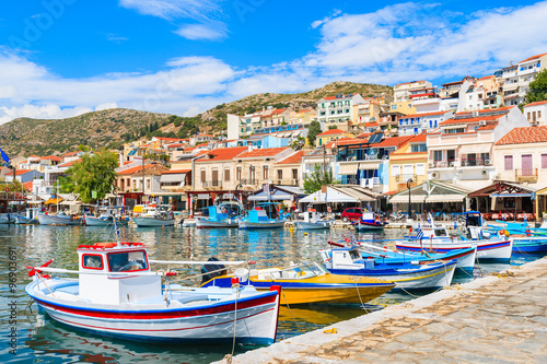 Traditional colourful Greek fishing boats in Pythagorion port, Samos island, Greece