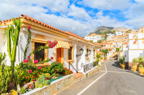 Street with typical Canary style holiday apartments in Costa Adeje, Tenerife, Canary Islands, Spain