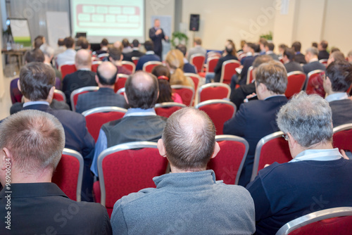 business conference: rear view of the people in a conference hall