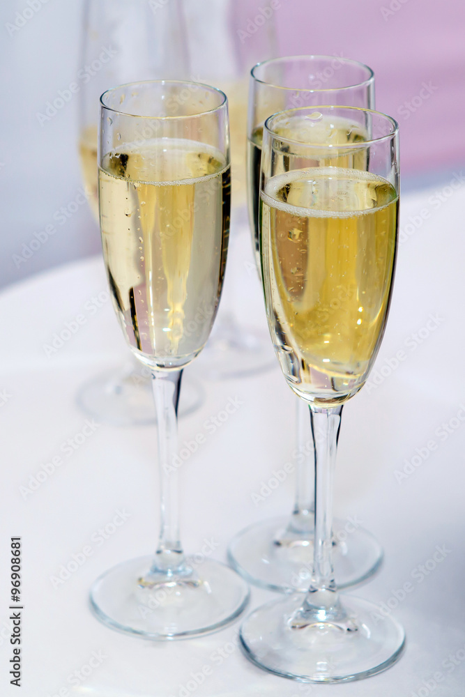 Champagne in glasses. A festive table. Liquor by the glass. A feast with alcohol. Wine poured into wine glasses. Champagne in glasses. A festive table. Liquor by the glass. A feast with alcohol. Wine poured into wine glasses.