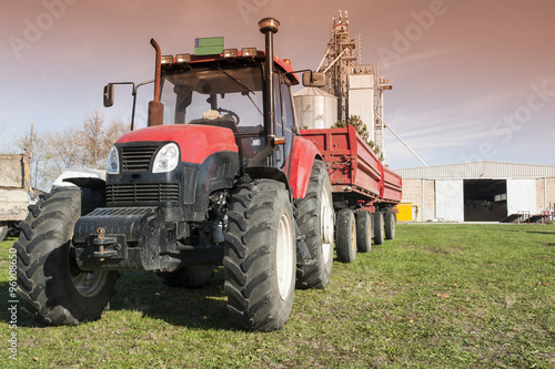 Tractor with silo in background