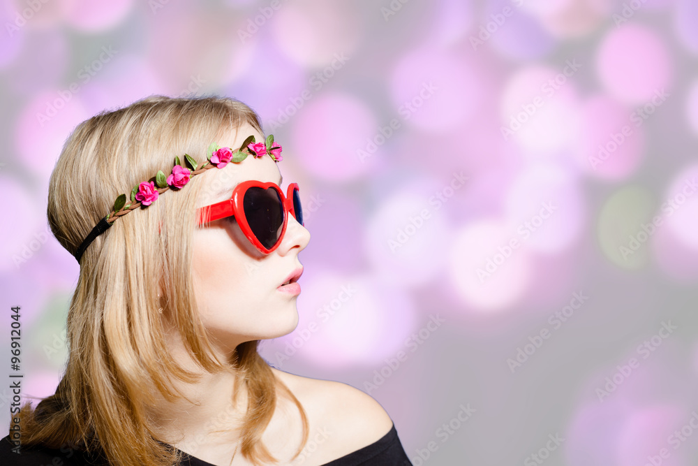 Beautiful girl in heart shaped sunglasses on bokeh background Beautiful girl in heart shaped sunglasses on bokeh background