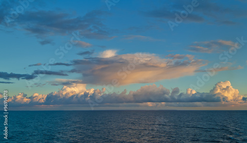 Clouds over calm sea at evening.