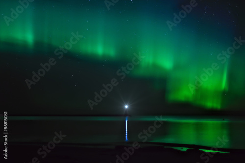                   Landscape with Aurora Borealis over the Ladoga Lake and a lighthouse