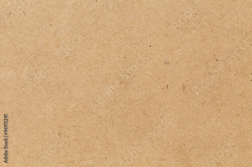 Pressed beige chipboard texture.