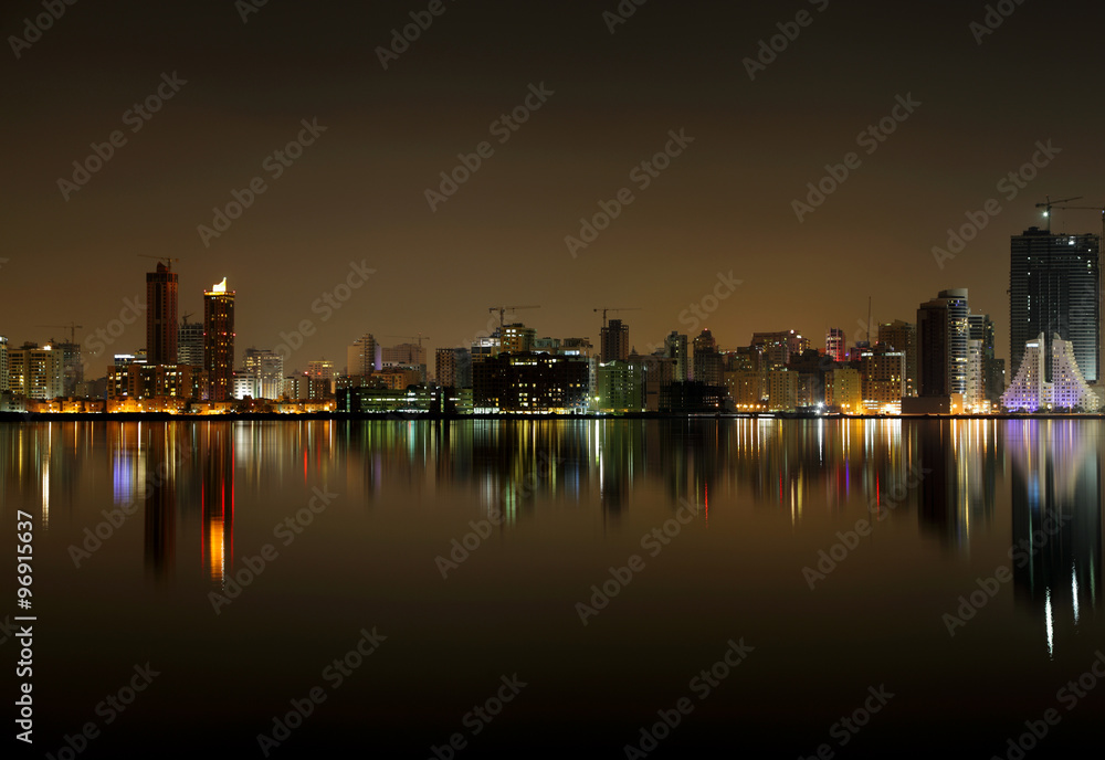 A beautiful view of Bahrain skyline during night and its reflect