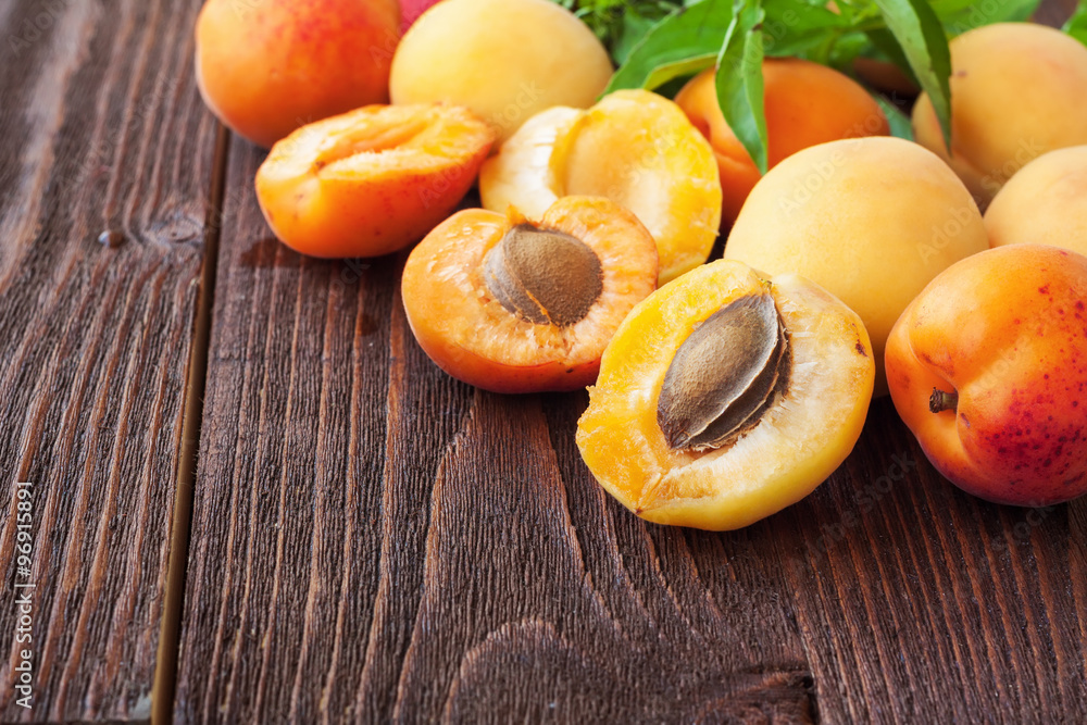 Fresh apricots on wooden table Fresh apricots on wooden table